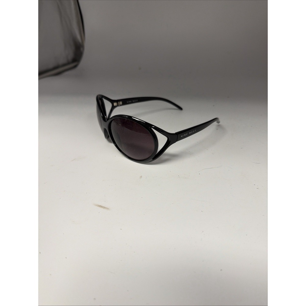 Nine West sunglasses feature a distinct cut-out design on the oval frames